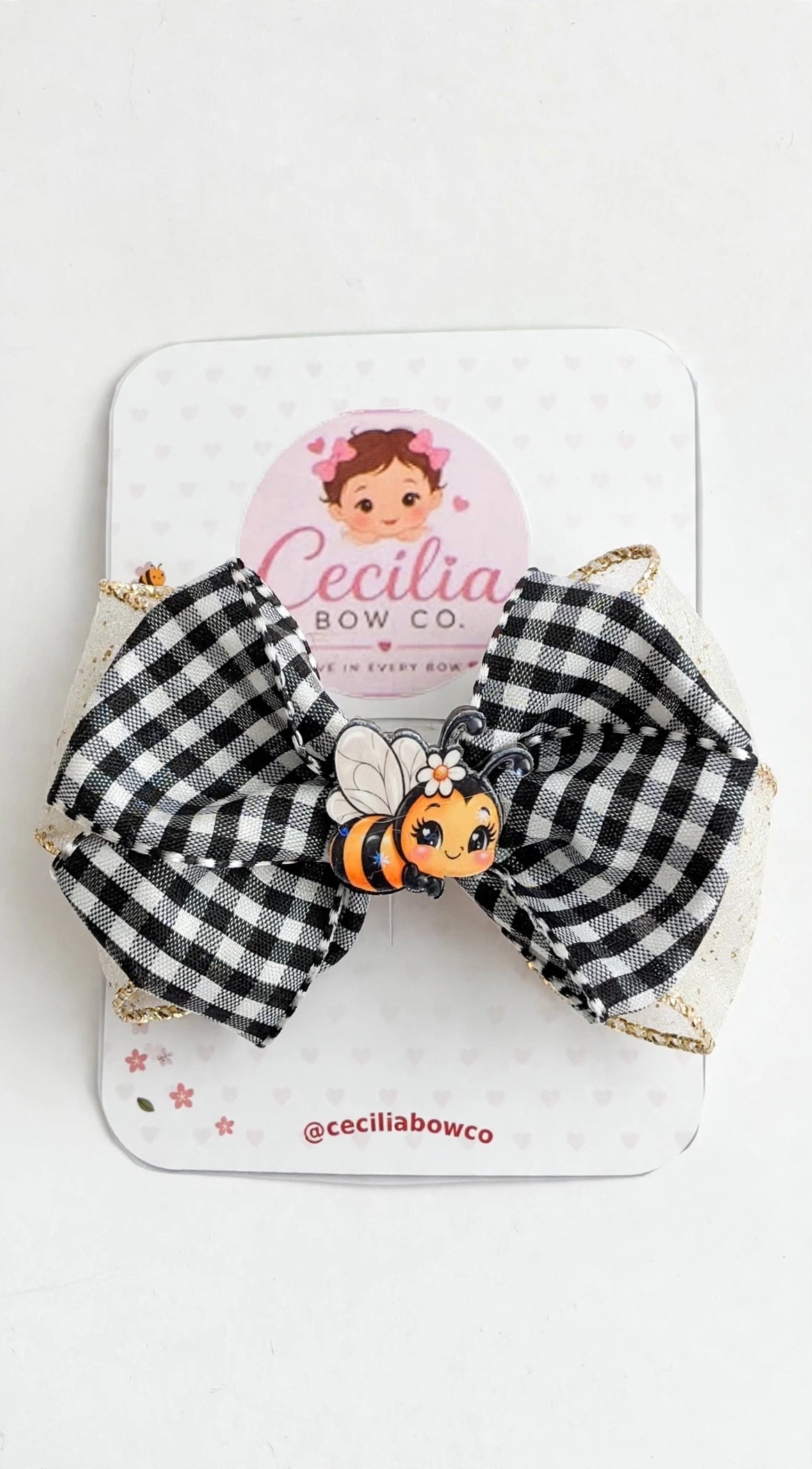Black and white gingham bow with gold glitter edges and a cute bee applique