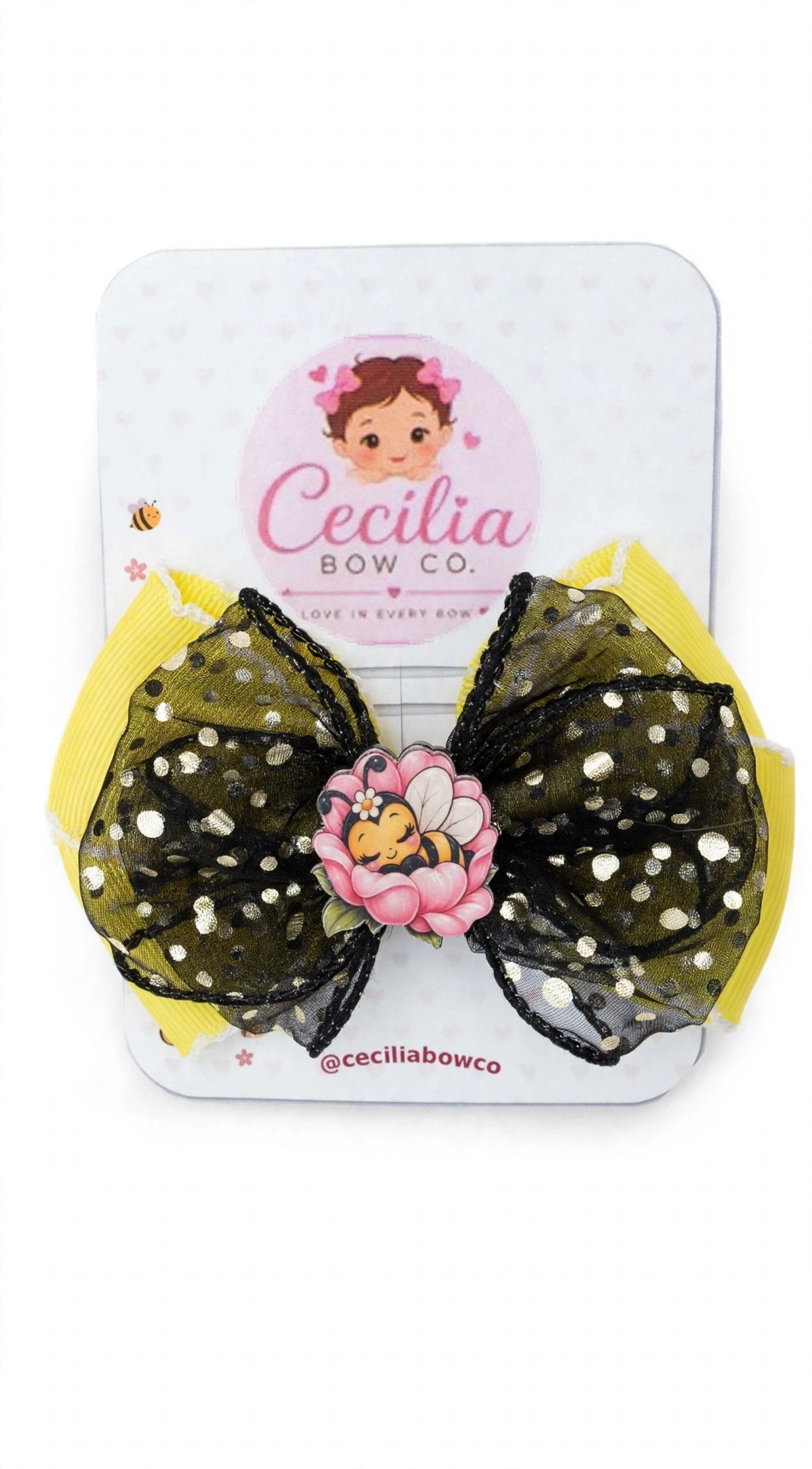 Yellow and black bow with pink flower and sleeping bee centerpiece