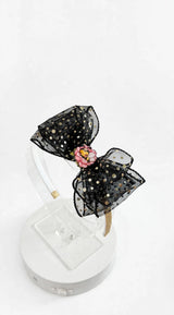 Black sheer headband with gold polka dots and pink flower with sleeping bee